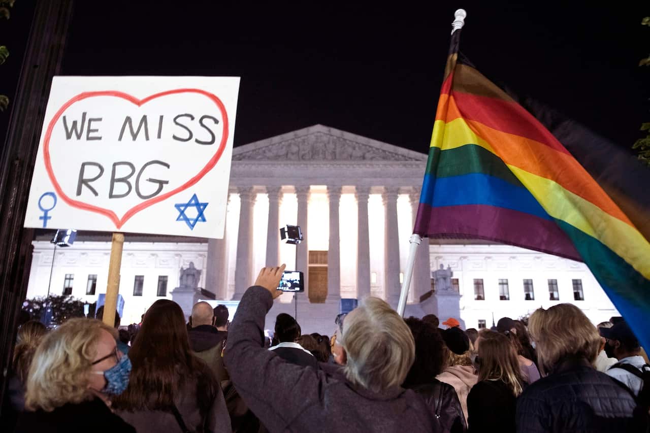 People gather at the US Supreme Court to honor the late Justice Ruth Bader Ginsburg, in Washington.