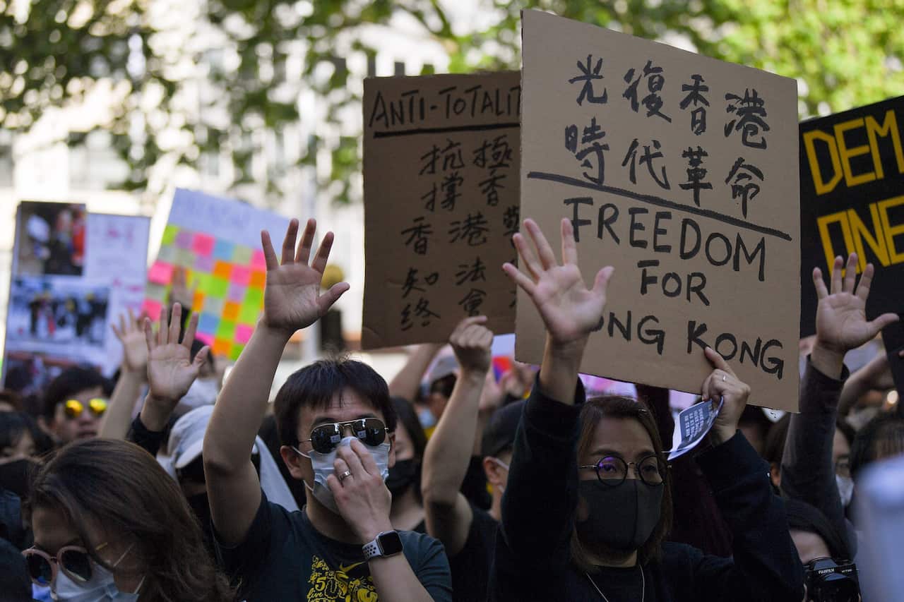 Pro democracy supporters are seen during a Hong Kong pro-democracy demonstration in Sydney, Sunday, September 29, 2019. (AAP Image/Steven Saphore) NO ARCHIVING