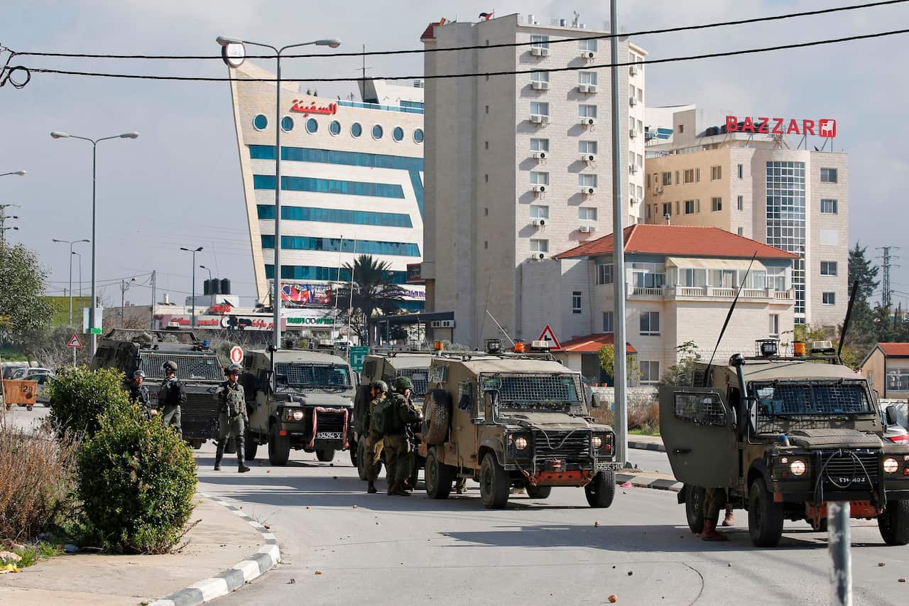 Israeli soldiers deploy during clashes in the West Bank city of Ramallah following a raid on December 10, 2018, one day after a drive-by shooting attack next to a settlement which many Israelis were injured.