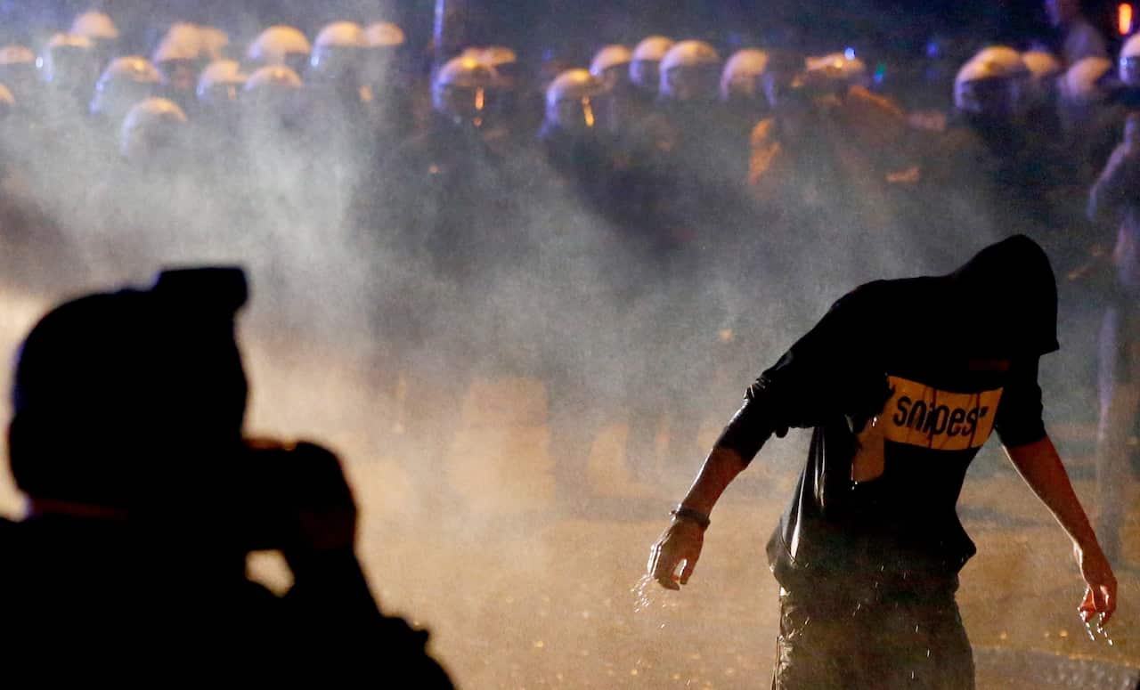A water gun shoots at protesters near the 'Rote Flora' building in 'Schanzenviertel' quarter ahead of the G20 summit in Hamburg, Germany