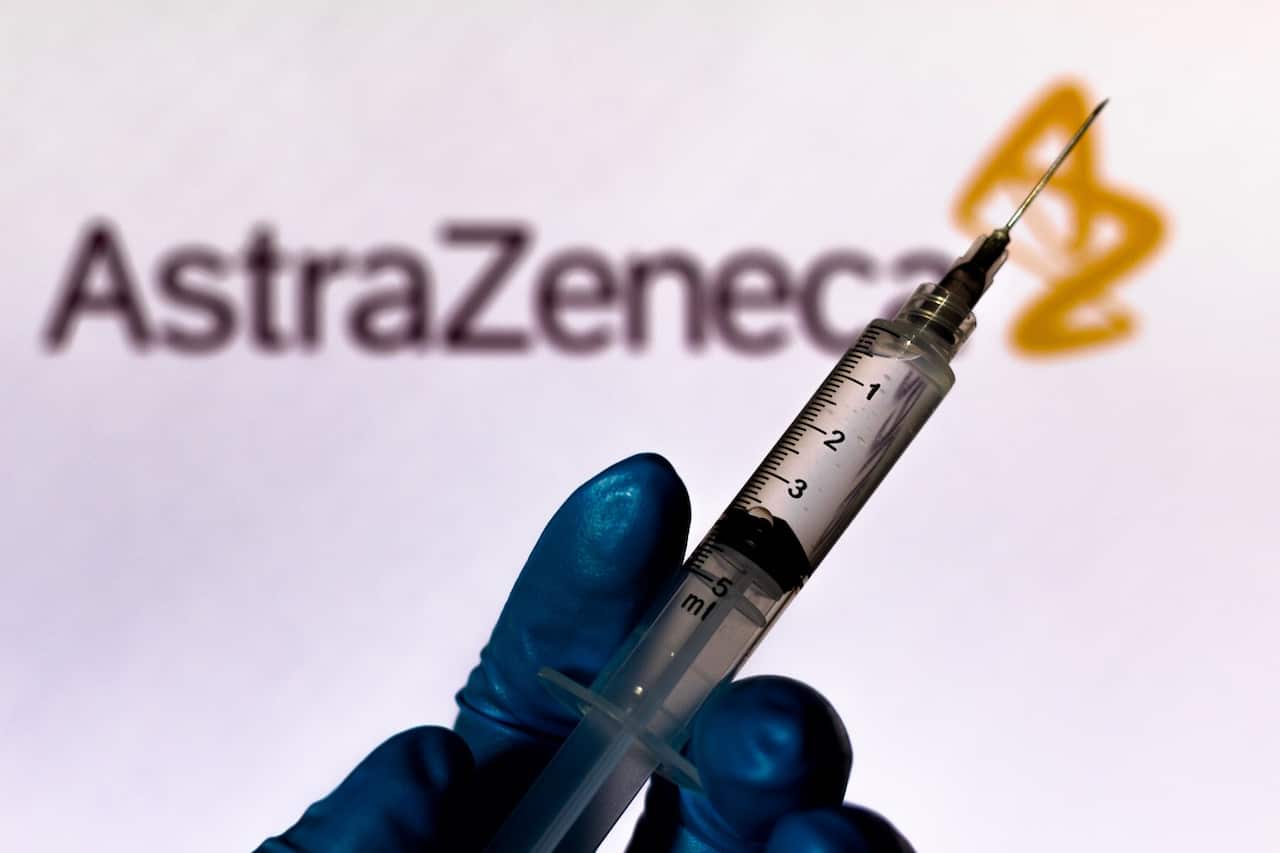 Medical syringe with AstraZeneca company logo displayed