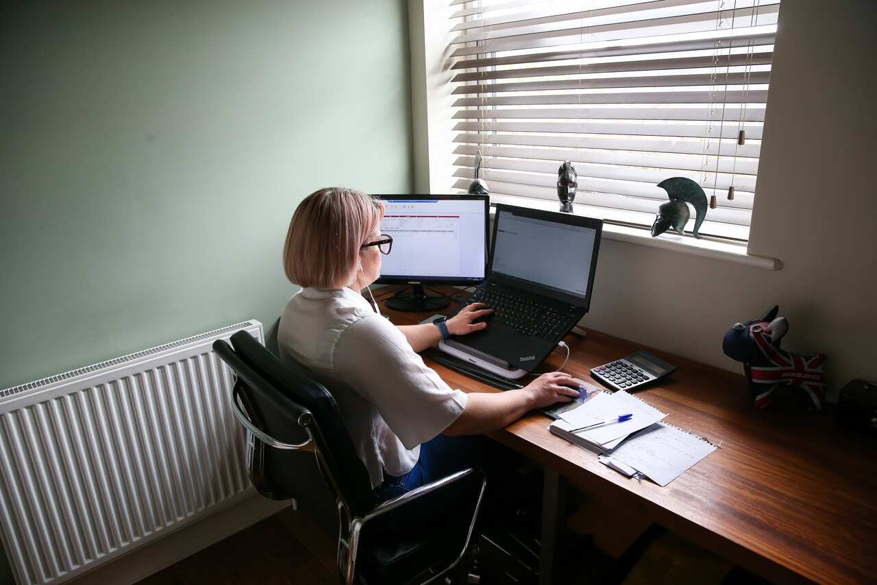 An account manager works from a converted home office during the Coronavirus pandemic.