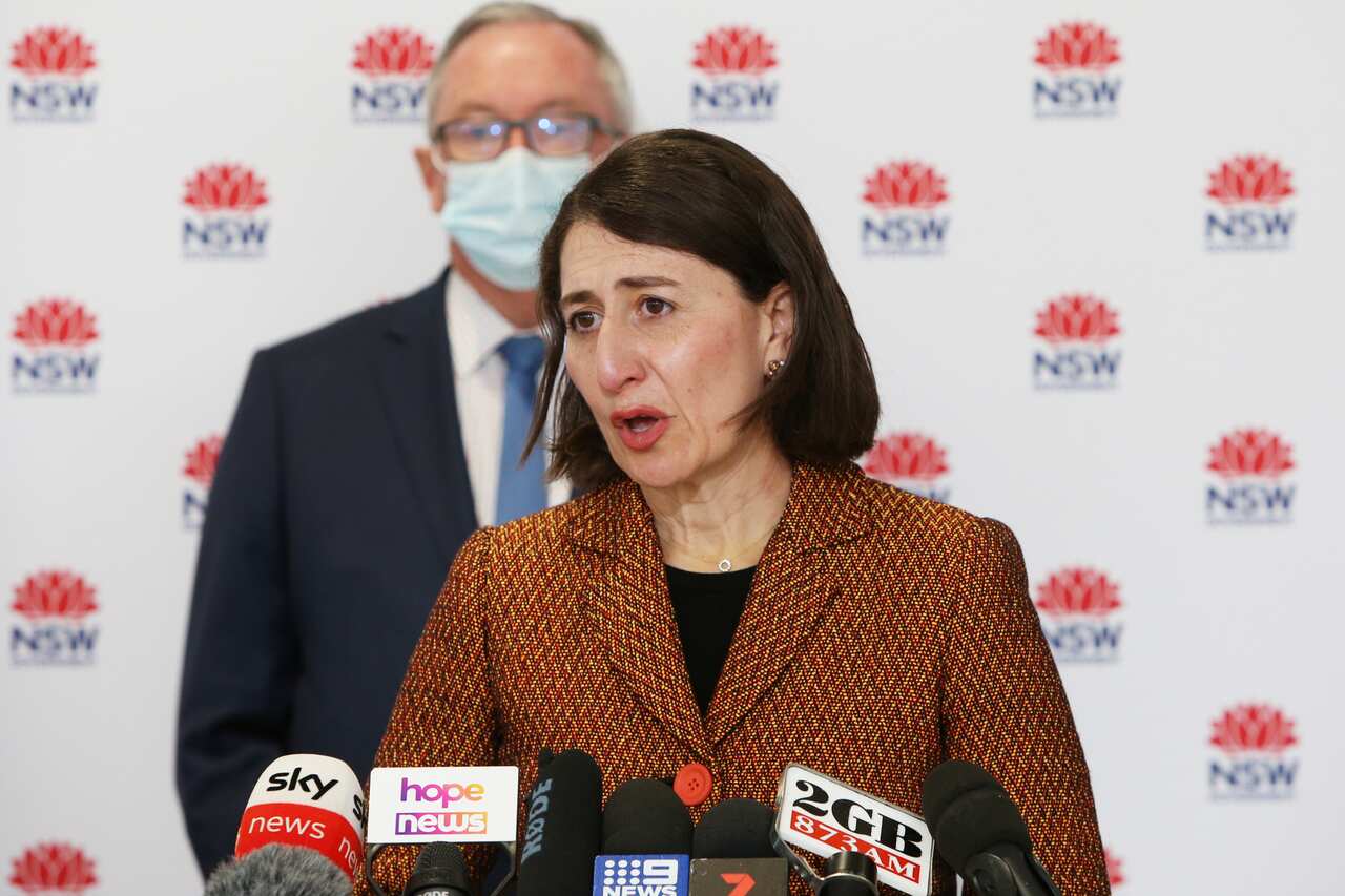NSW Premier Gladys Berejiklian speaks to the media with NSW Health Minister Brad Hazzard during a press conference in Sydney, Monday, 26 July, 2021. 