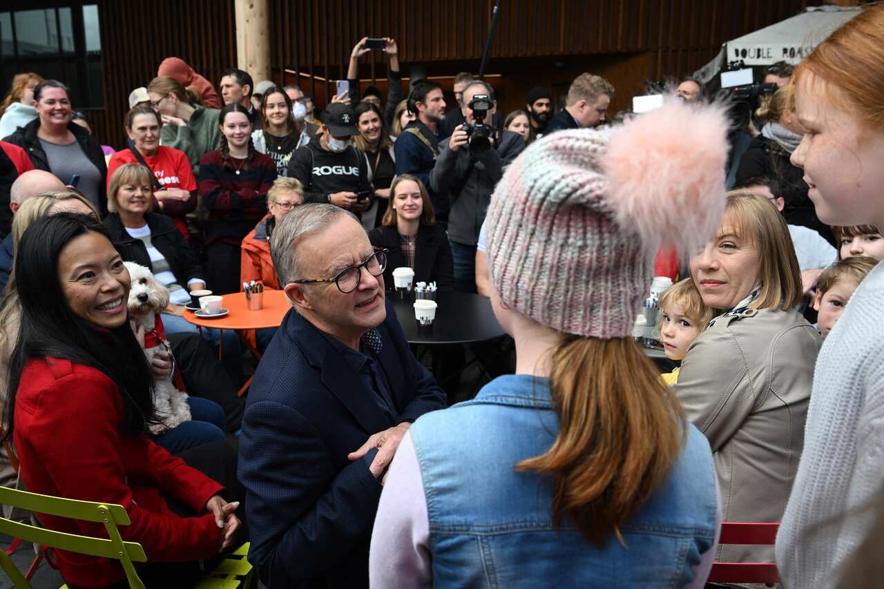 Incoming prime minister Anthony Albanese and Labor's new member for Reid, Sally Sitou soak up electoral victory in Marrickville (AAP Image/Dean Lewins)