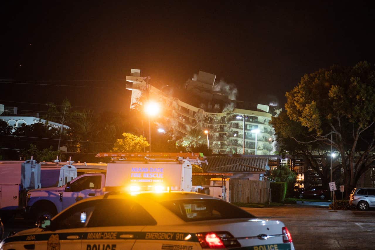 The rest of the Champlain South tower is seen being demolished by a controlled explosion in Surfside, Florida, north of Miami Beach, late on 4 July, 2021.