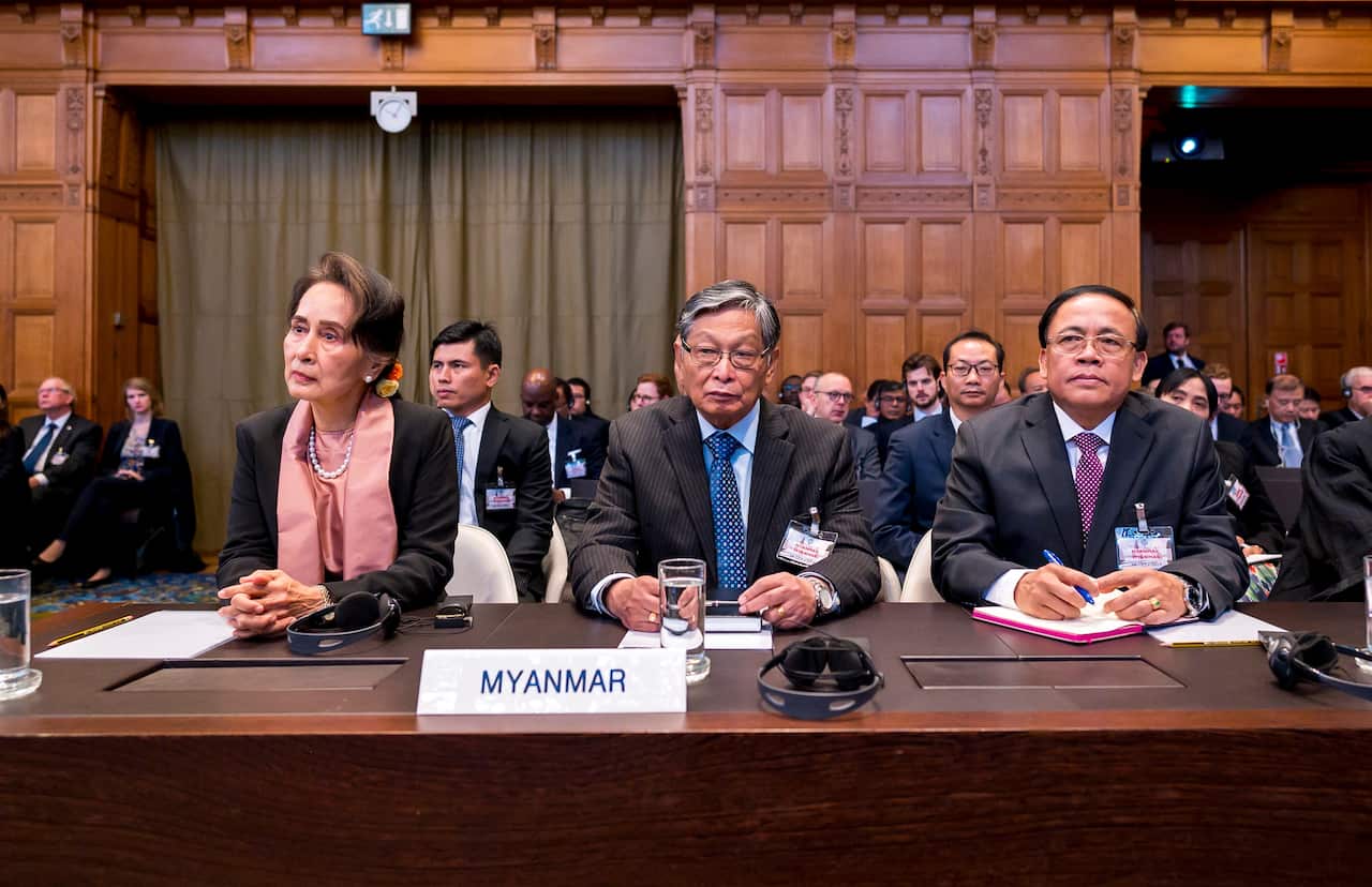 Aung San Suu Kyi (L) and members of her delegation appearing before the ICJ on the first day of hearings in the case the Gambia vs Myanmar at The Hague.