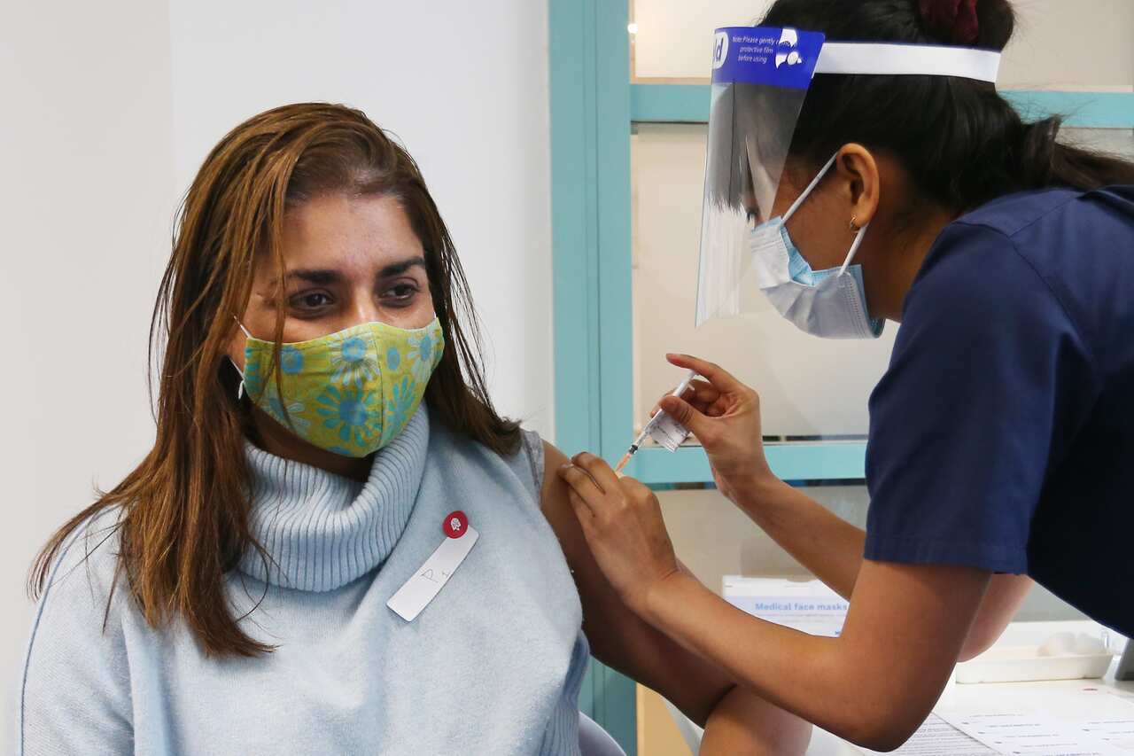 A nurse administers the Pfizer vaccine to a client at the St Vincent's COVID-19 Vaccination Clinic in Sydney on 1 July, 2021.
