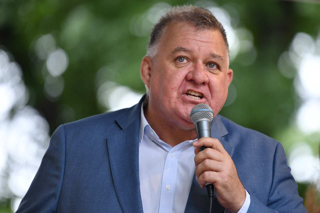 MP Craig Kelly speaks to the crowd in Melbourne