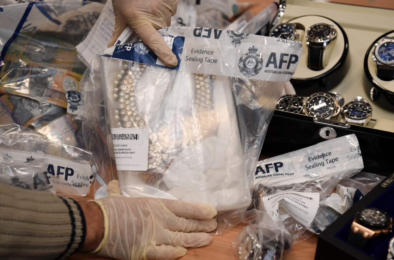 Seized items are displayed at a press conference at the AFP headquarters in Sydney on Thursday, May 18, 2017. (AAP)