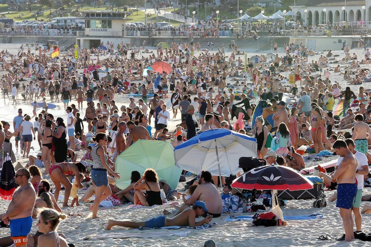 People flooded Bondi Beach on Friday despite advice to socially isolate to slow the spread of COVID-19. 
