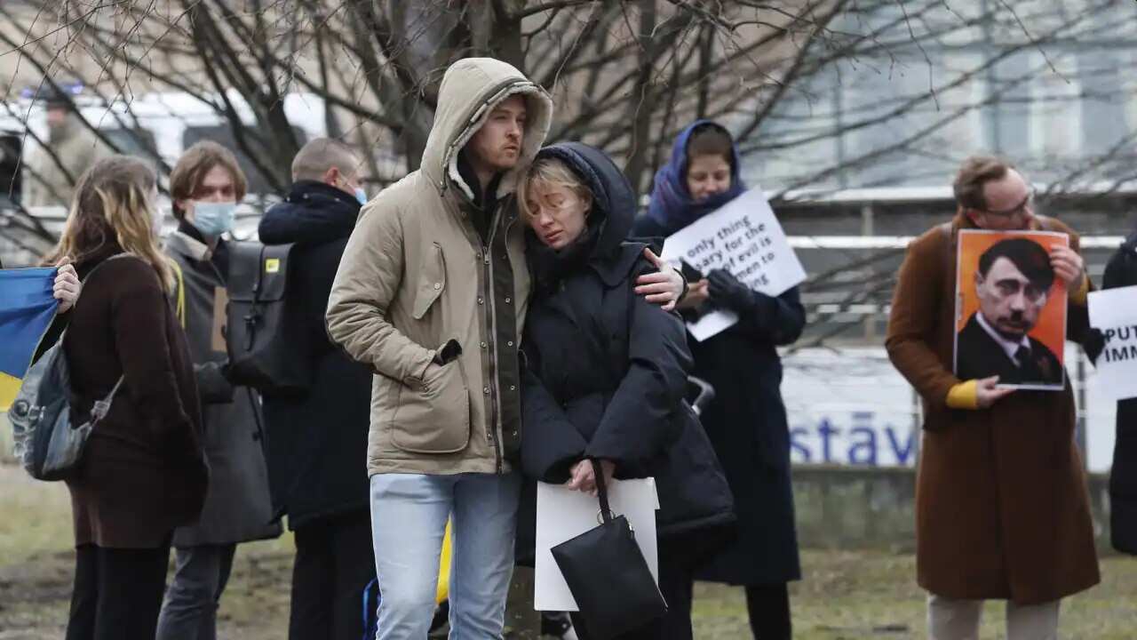 People protest against Russia's military operation in Ukraine outside the Russian Embassy in Riga, Latvia, 24 February 2022.