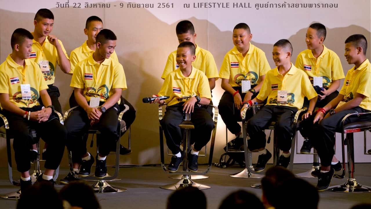 Members of the Wild Boars football team laugh during a public discussion on 6 September 2018.