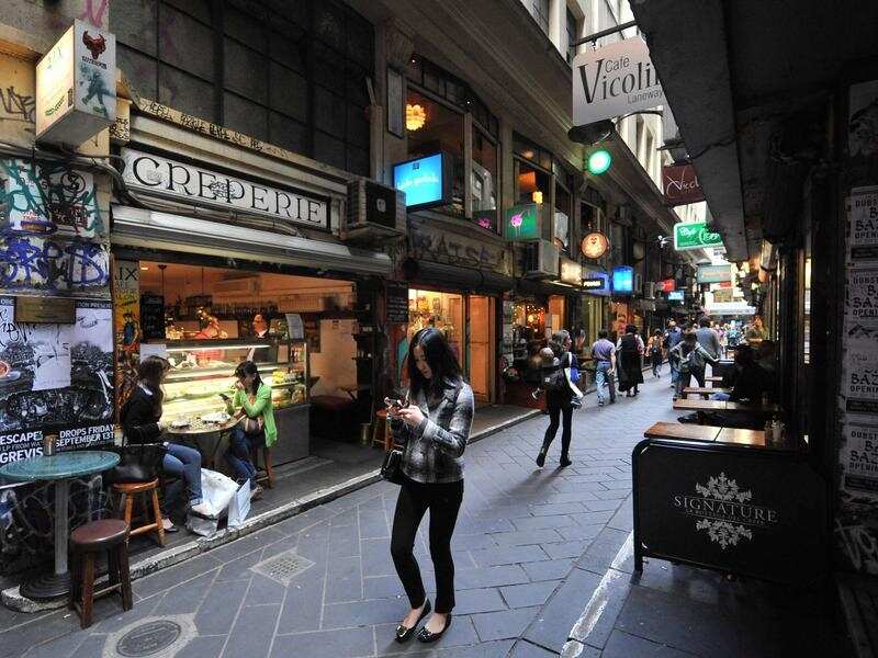 Pedestrians walk in Degraves Street in Melbourne