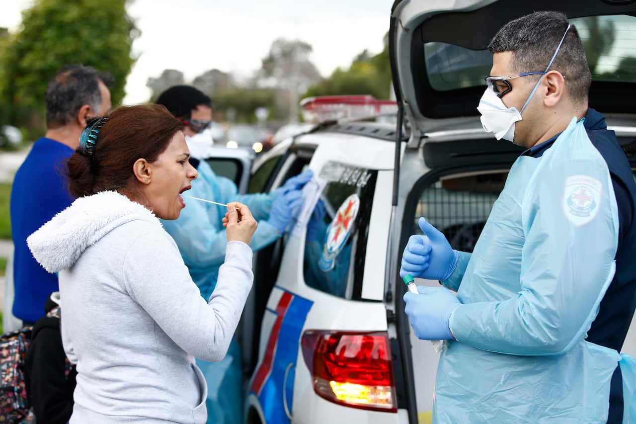 Paramedics perform COVID19 tests in Broadmeadows, Melbourne.
