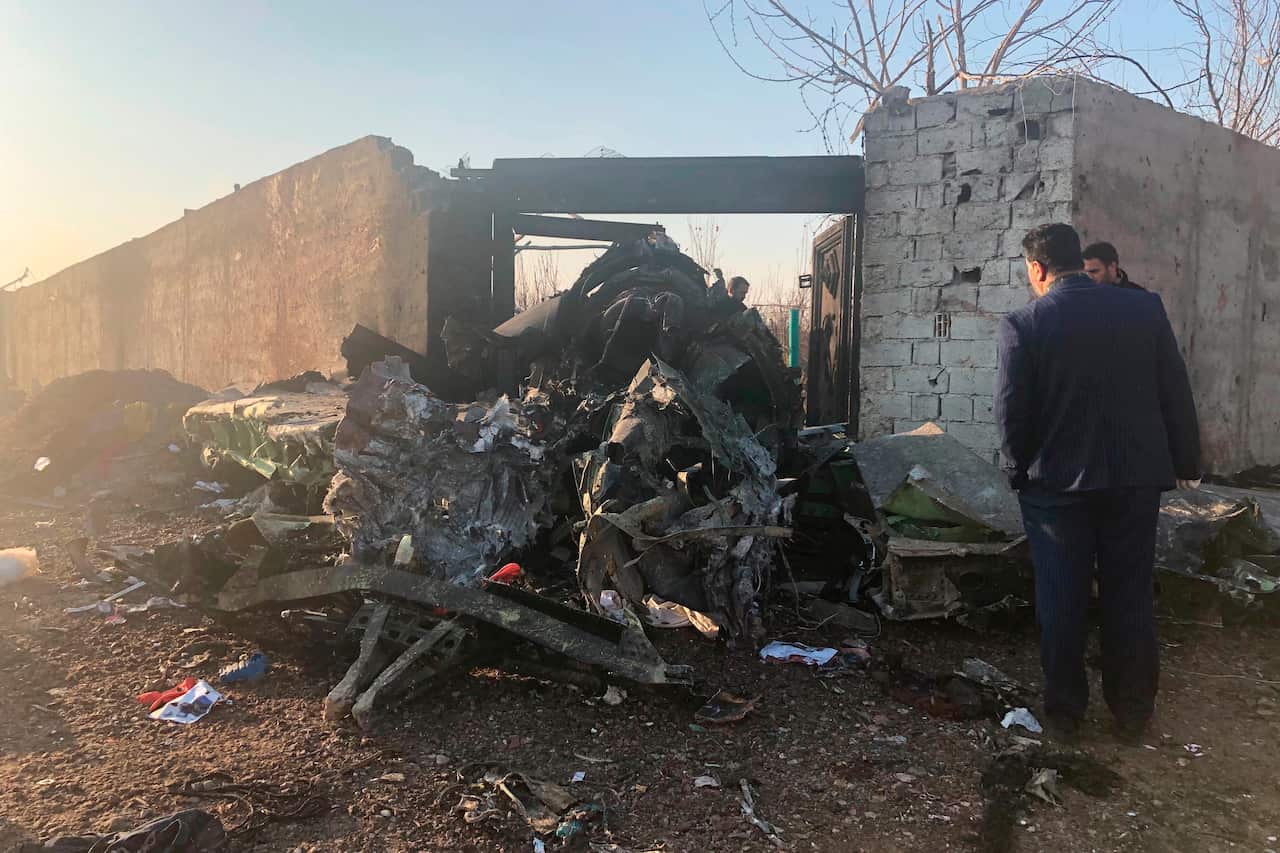 Wreckage left by the crashed passenger jet on the outskirts of Tehran, Iran.