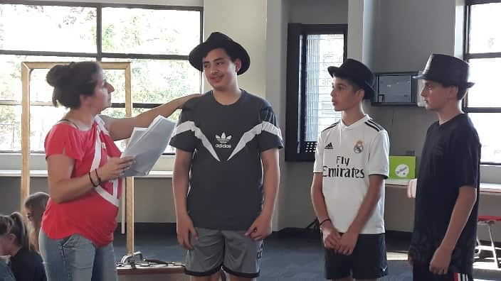 At the play rehearsals. 