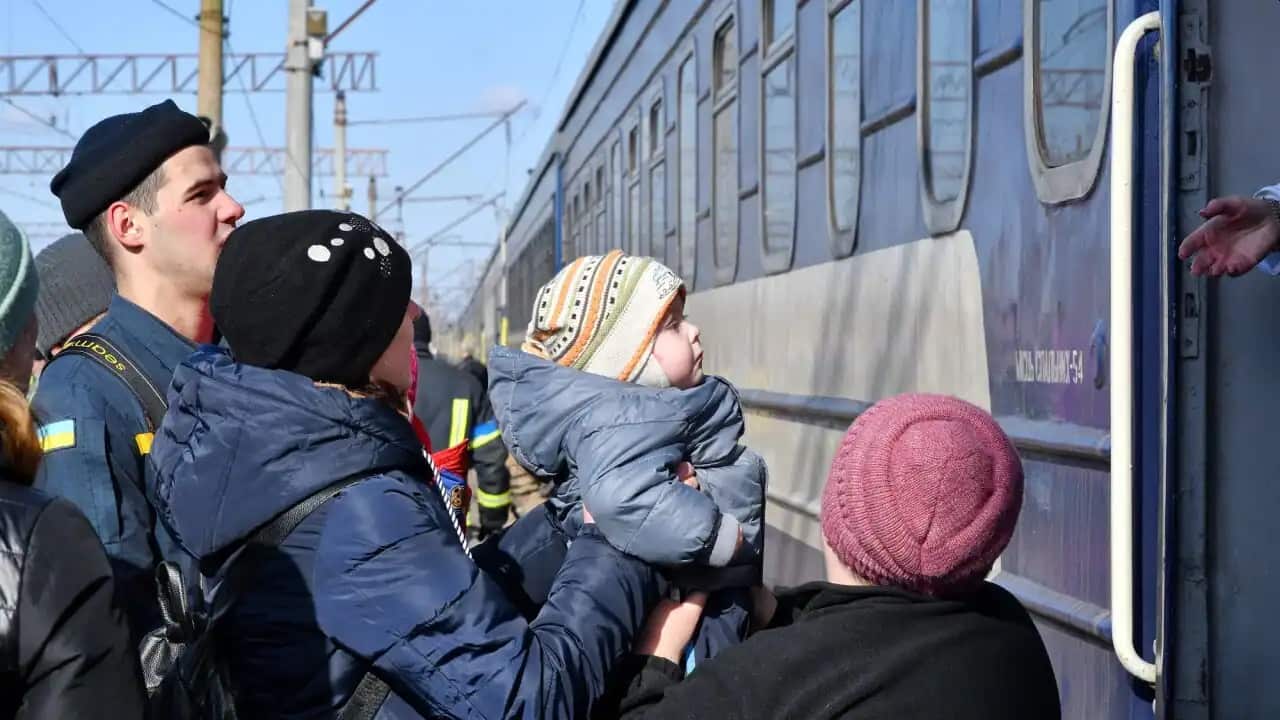 Residents in Kramatorsk board an evacuation train.