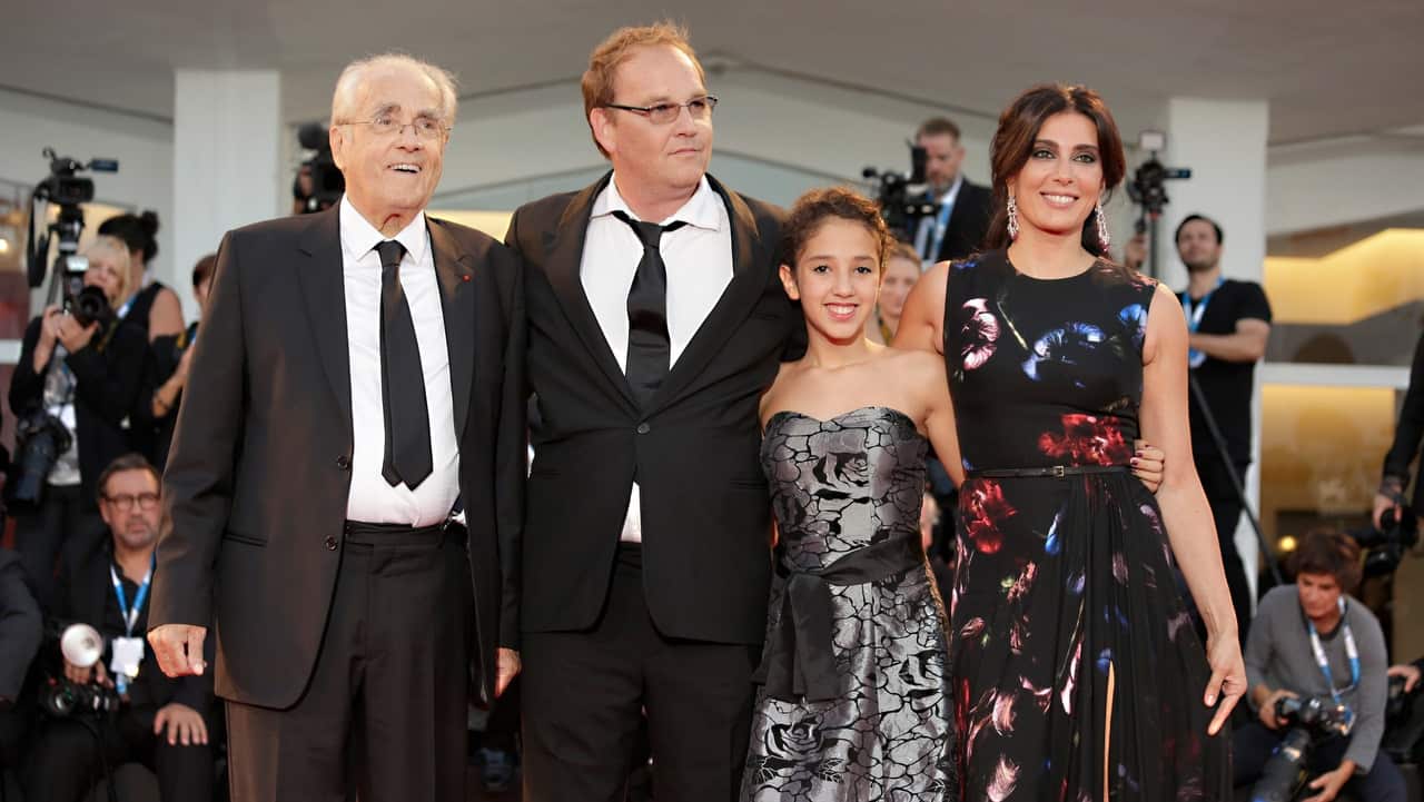 From left, conductor Michel Legrand, director Xavier Beauvois, actors Seli Gmach and Nadine Labaki during the 71st edition of the Venice Film Festival in 2014.