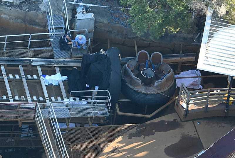 Emergency service personnel are seen at the scene where four people died at Dreamworld on the Gold Coast. 