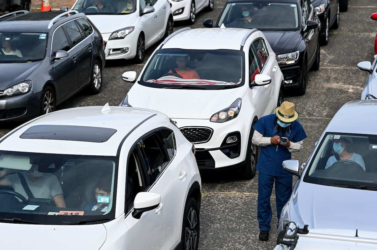 People queue in their cars for a COVID-19 PCR test at Bondi Beach in Sydney, Saturday, 1 January, 2022.
