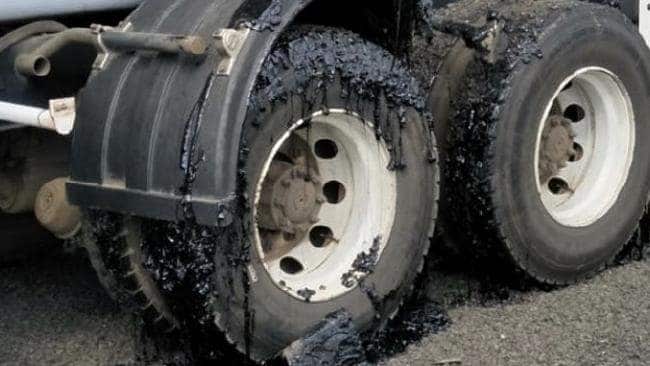 Tarmac has melted along the Millaa Millaa-Malanda Road at Tarzali, closing off small towns as motorists are forced to abandon their vehicles on the road.