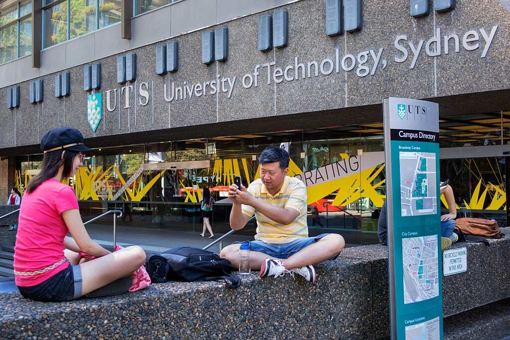Australia, University of Technology Sydney man taking picture iPhone