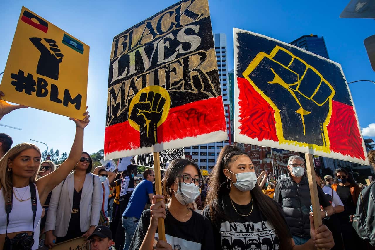Protesters participate in a Black Lives Matter rally in Brisbane, 6 June 2020. 