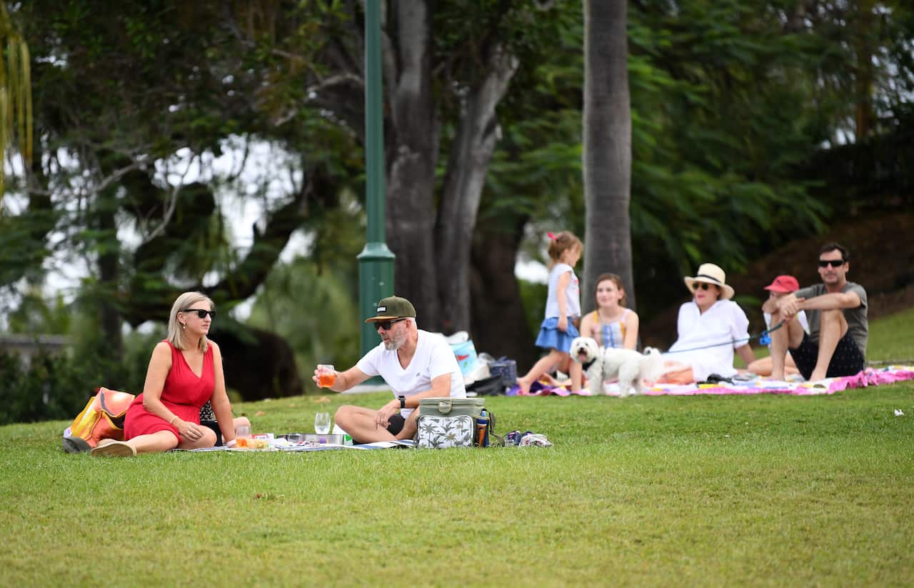 People enjoy a Mother's Day picnic in Brisbane, Sunday, May 10, 2020. Physical distancing restrictions have eased in Queensland, allowing gatherings of up to 10 people together in a public space. (AAP Image/Dan Peled) NO ARCHIVING