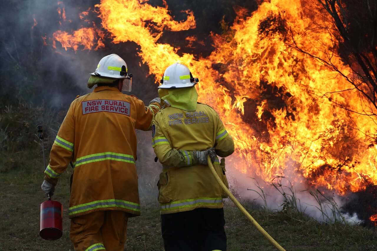 Firefighters battle bushfires in northern NSW. There's fears ash from the fires will contaminate drinking water. 