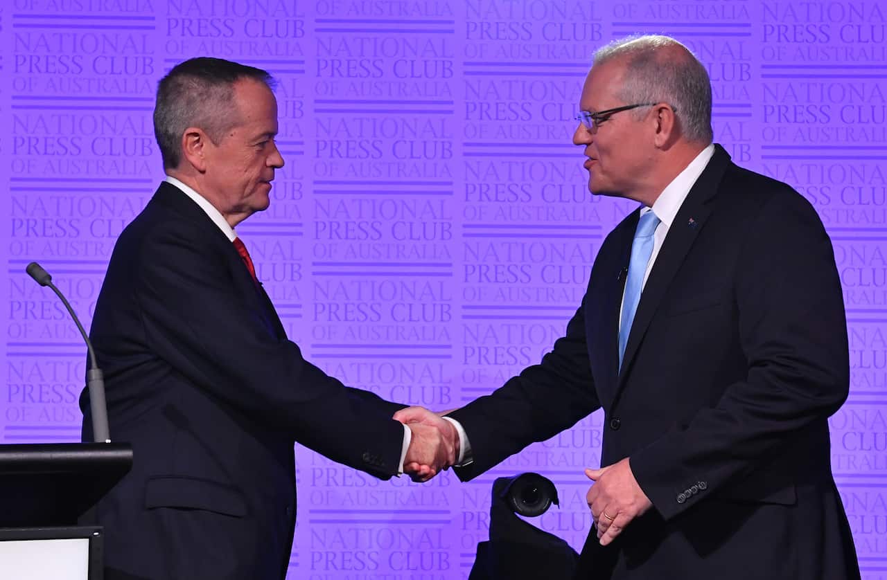Leader of the Opposition Bill Shorten and Prime Minister Scott Morrison shake hands before the third Leaders Debate at the National Press Club in Canberra, Wednesday, May 8, 2019. (AAP Image/Mick Tsikas) NO ARCHIVING