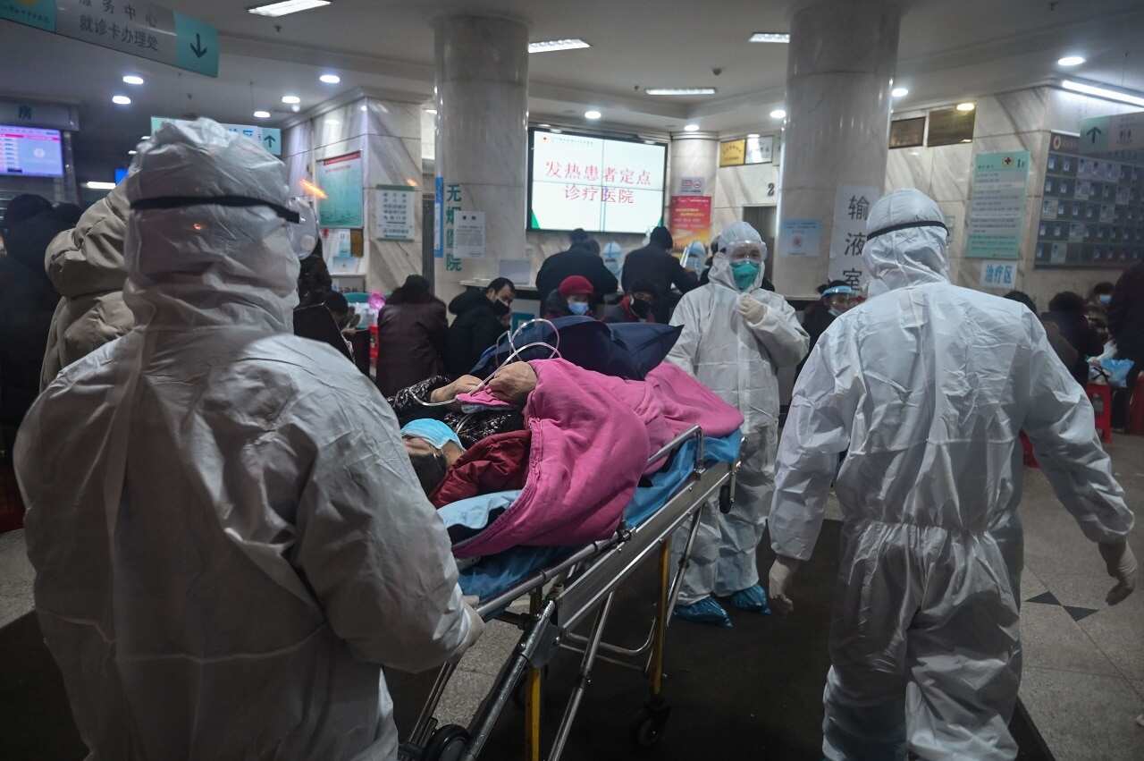 Medical staff with a patient at the Wuhan Red Cross Hospital.
