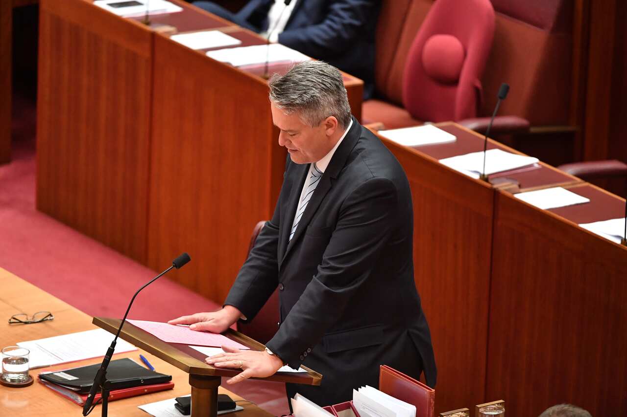 Minister for Finance Mathias Cormann makes a statement on Liberal member for Chisholm Gladys Liu in the Senate chamber at Parliament House in Canberra.