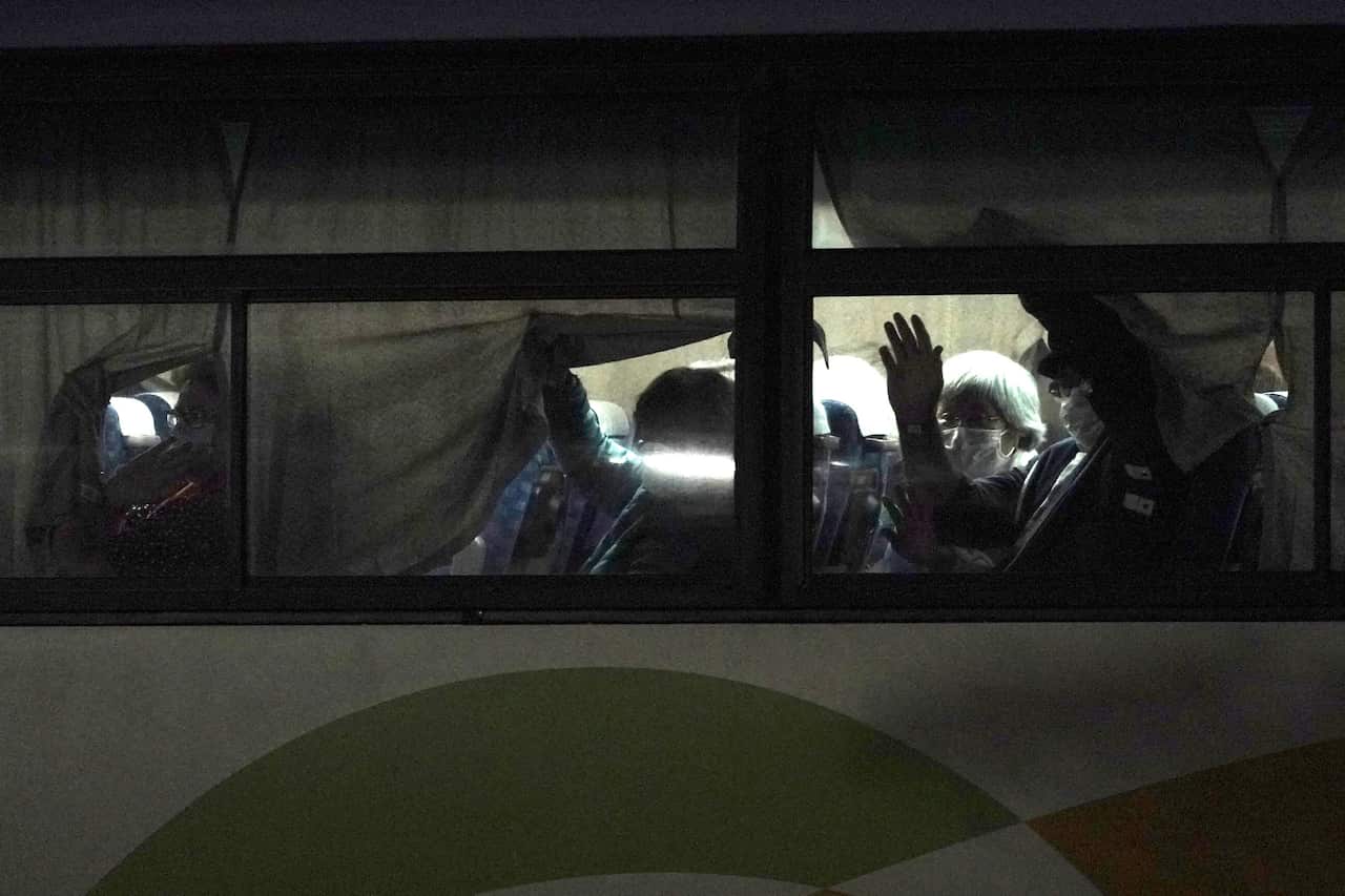 Buses carrying Australian passengers from the quarantined Diamond Princess cruise ship leave a port in Yokohama, near Tokyo, Japan.