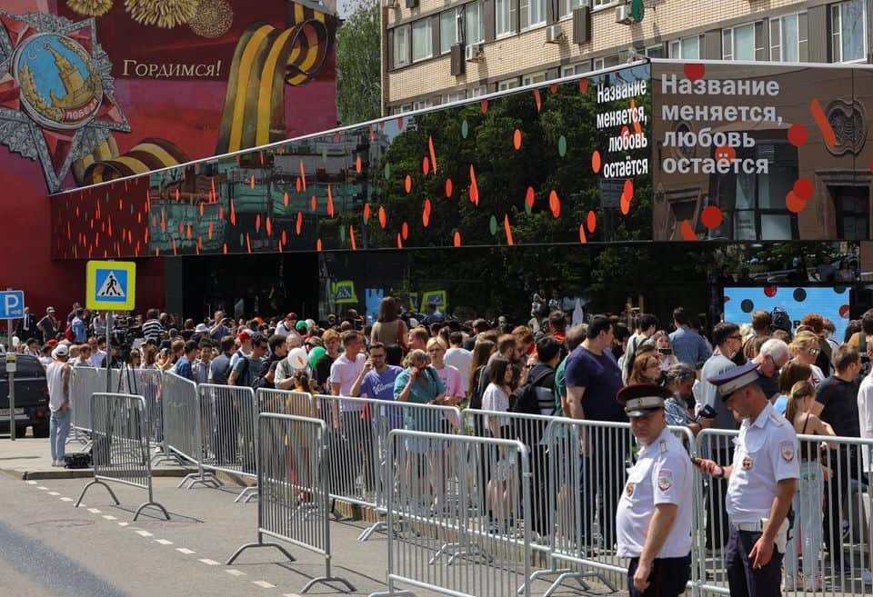 People gather near the new restaurant "Vkusno & tochka", which opens following McDonald's Corp company's exit from the Russian market, in Moscow, Russia June 12, 2022.
