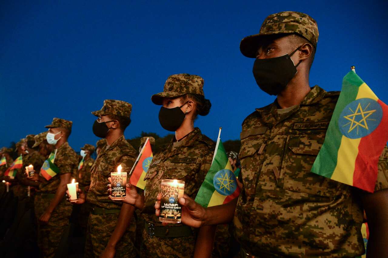 Ethiopian military personnel commemorate soldiers killed by forces loyal to the Tigray People's Liberation Front at the start of the conflict one year ago