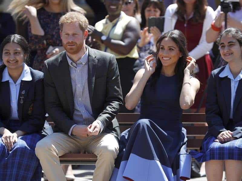 Prince Harry and Meghan with two students from Macarthur Girls' High.