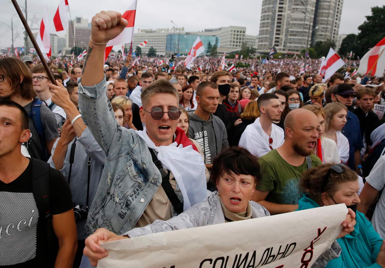 People shout slogans, as they attend a protest in Belarus (AAP)