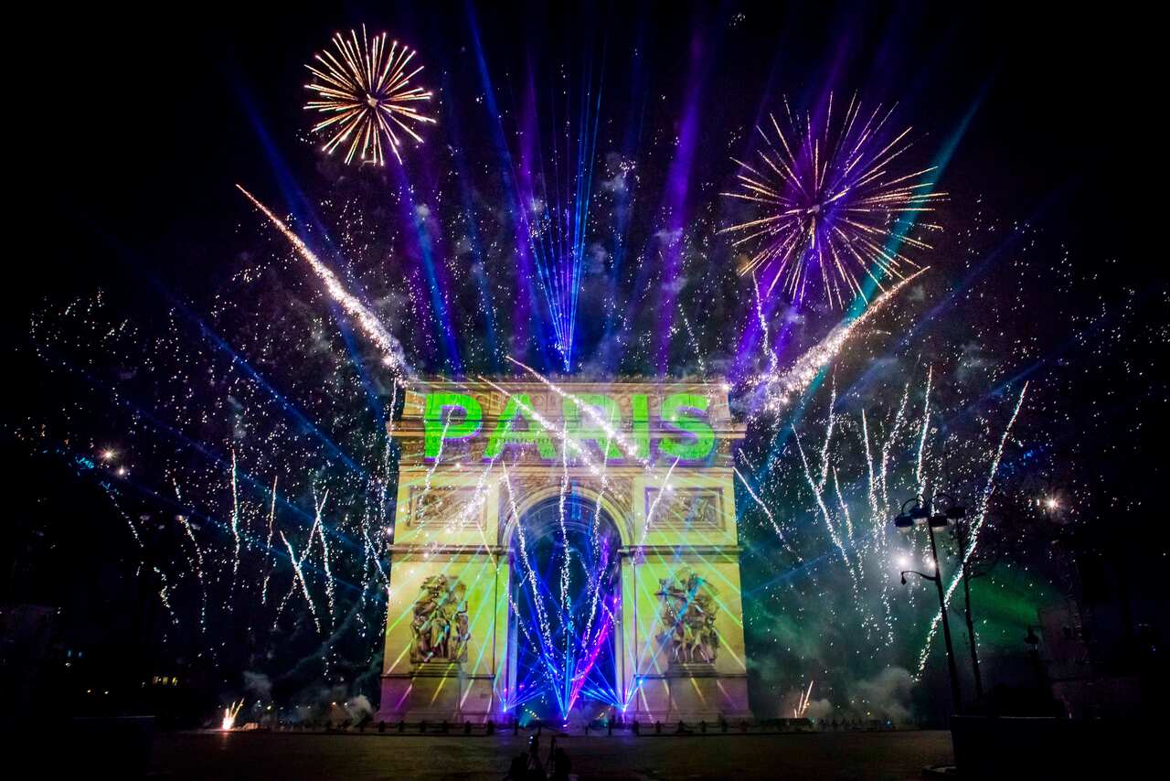 epa08096807 The New Year video display on the Arc de Triomphe on the Champs Elysees  in Paris, France, 01 January 2020.  EPA/CHRISTOPHE PETIT TESSON