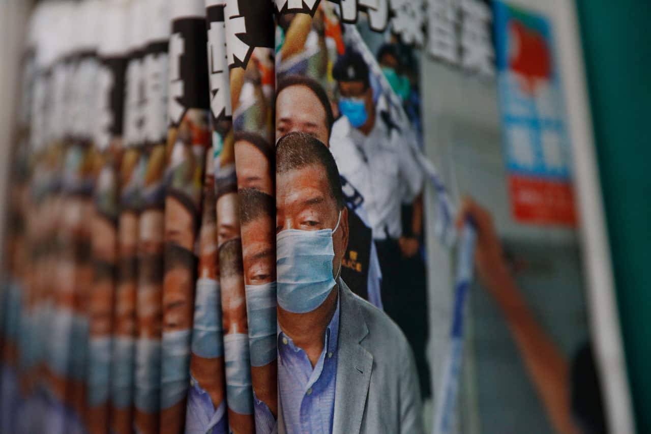 The Apple Daily newspaper with front pages featuring owner Jimmy Lai, now in prison, are displayed for sale at a newsstand in August 2020.