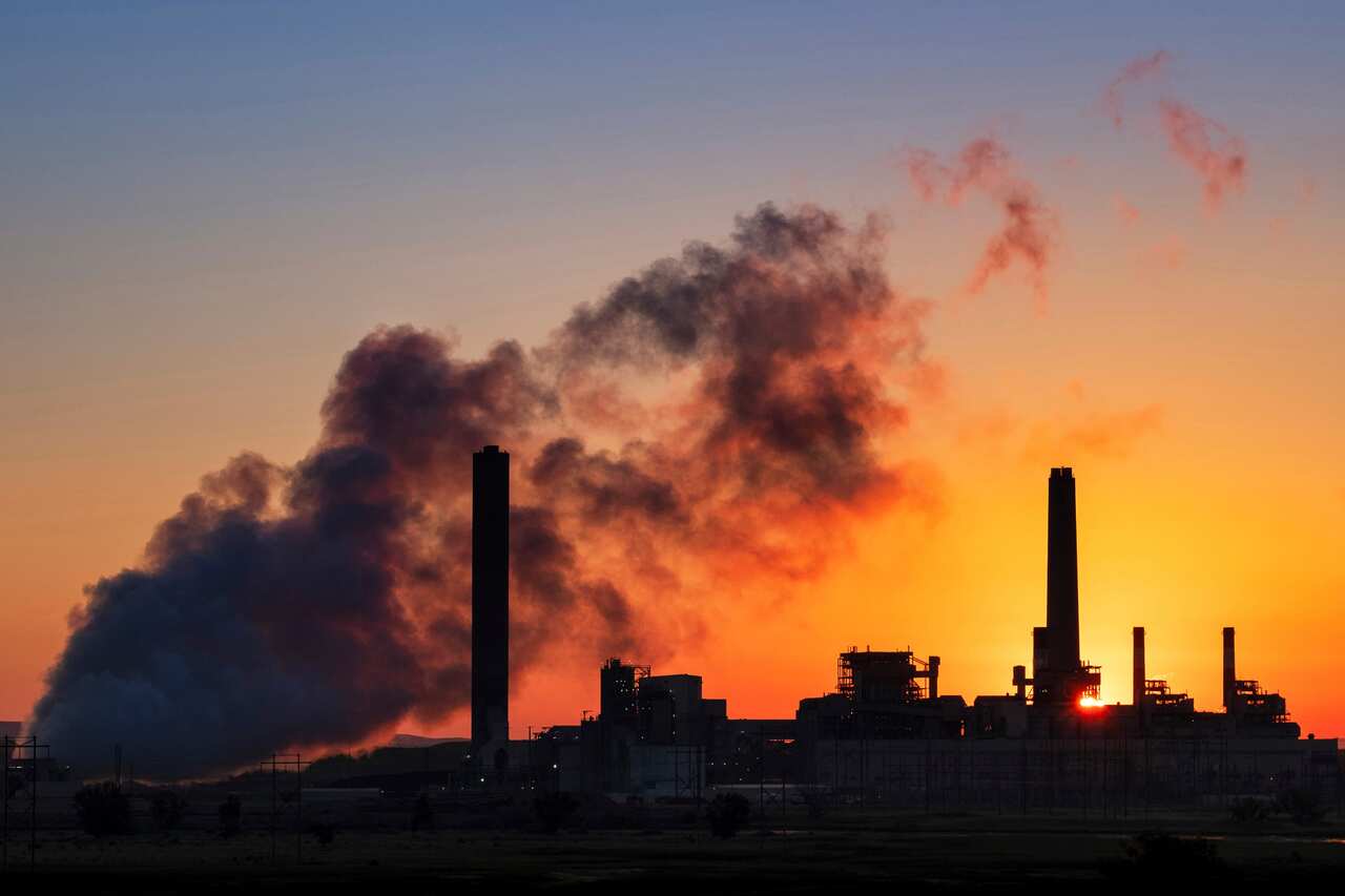 In this July 27, 2018, file photo, the Dave Johnson coal-fired power plant is silhouetted against the morning sun in Glenrock, Wyoming.