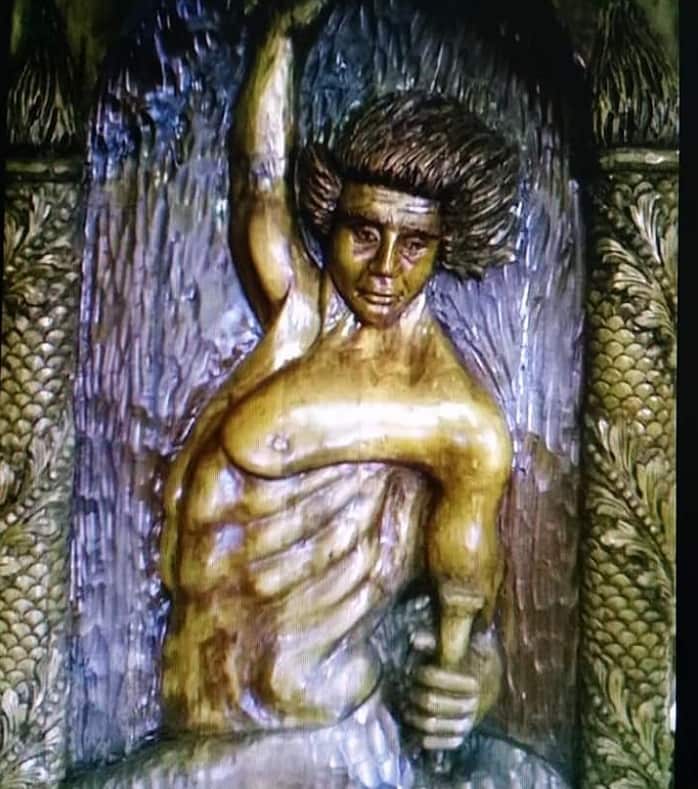 Wooden statue done by Sculptor Tom Mourad