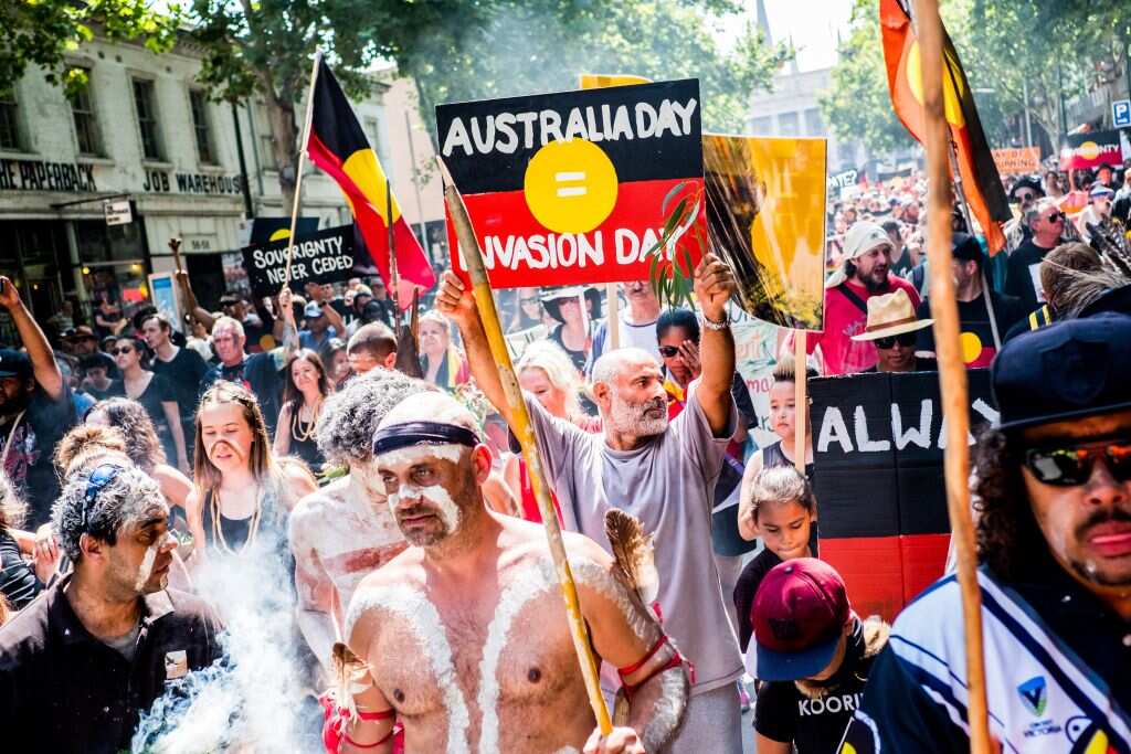 Protesters march during a protest by Aboriginal rights activist on Australia Day in Melbourne this year 2018. 