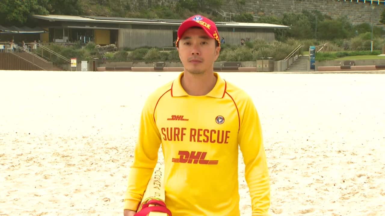 40-year-old Alex Chang volunteers at Sydney's Tamarama Beach.