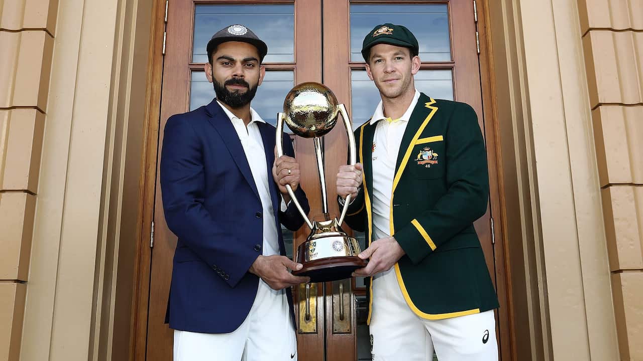 Virat Kohli and Tim Paine with the Border - Gavaskar trophy.