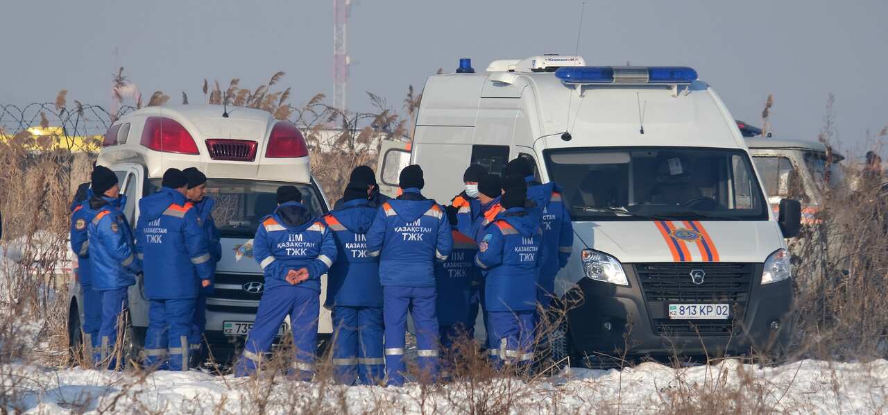 Rescuers work at the site of an airplane crash near Almaty airport, some 20 kilometres from the city of Almaty, Kazakhstan.