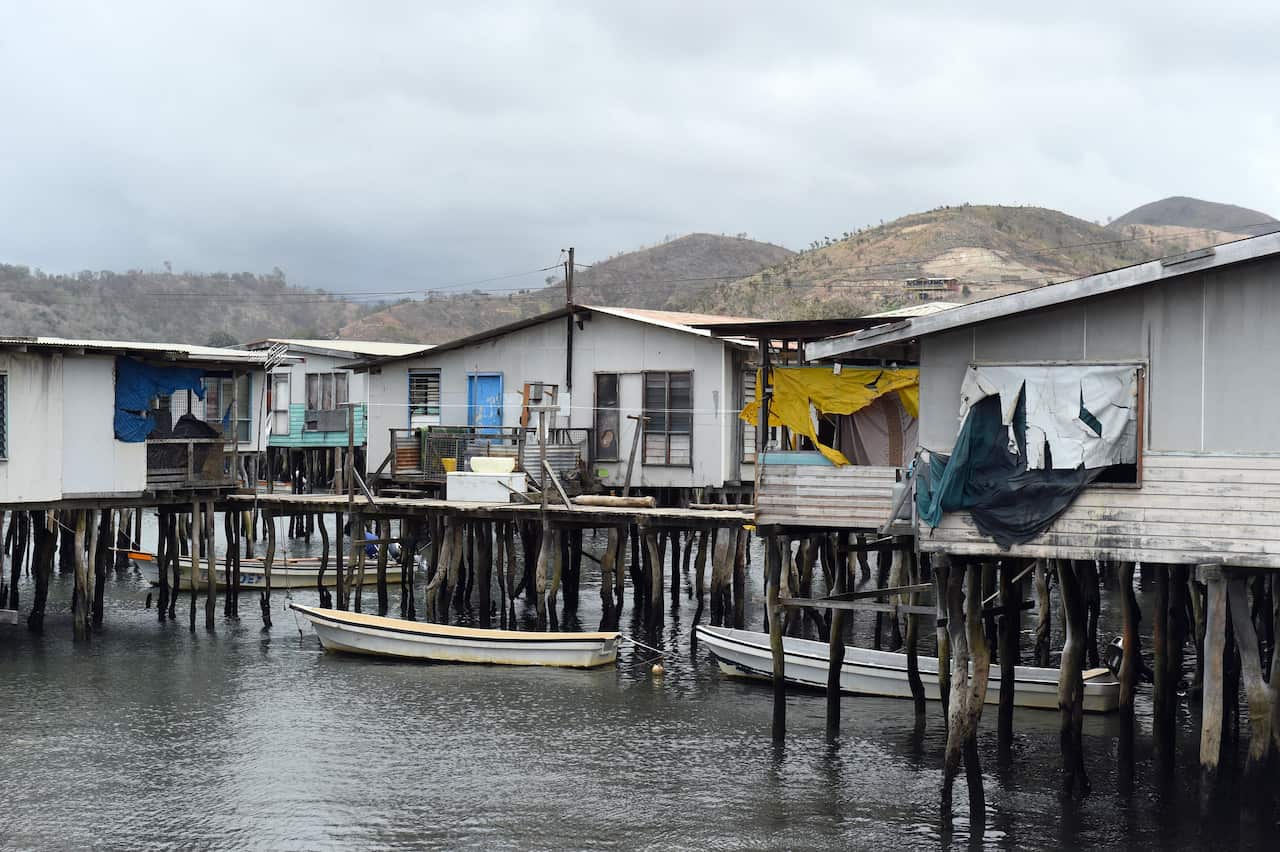 Boats are moored outside homes in the stilted village of Hanuabada near Port Moresby, Papua New Guinea.