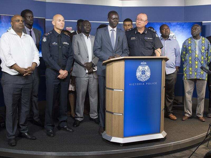 An African community leaders speaks to the media.