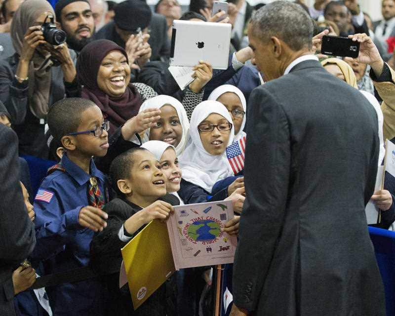 President Barack Obama stops to greets children from Al-Rahmah school and other guests during his visit to the Islamic Society of Baltimore, Wednesday, Feb. 3, 2016, in Baltimore, Md.