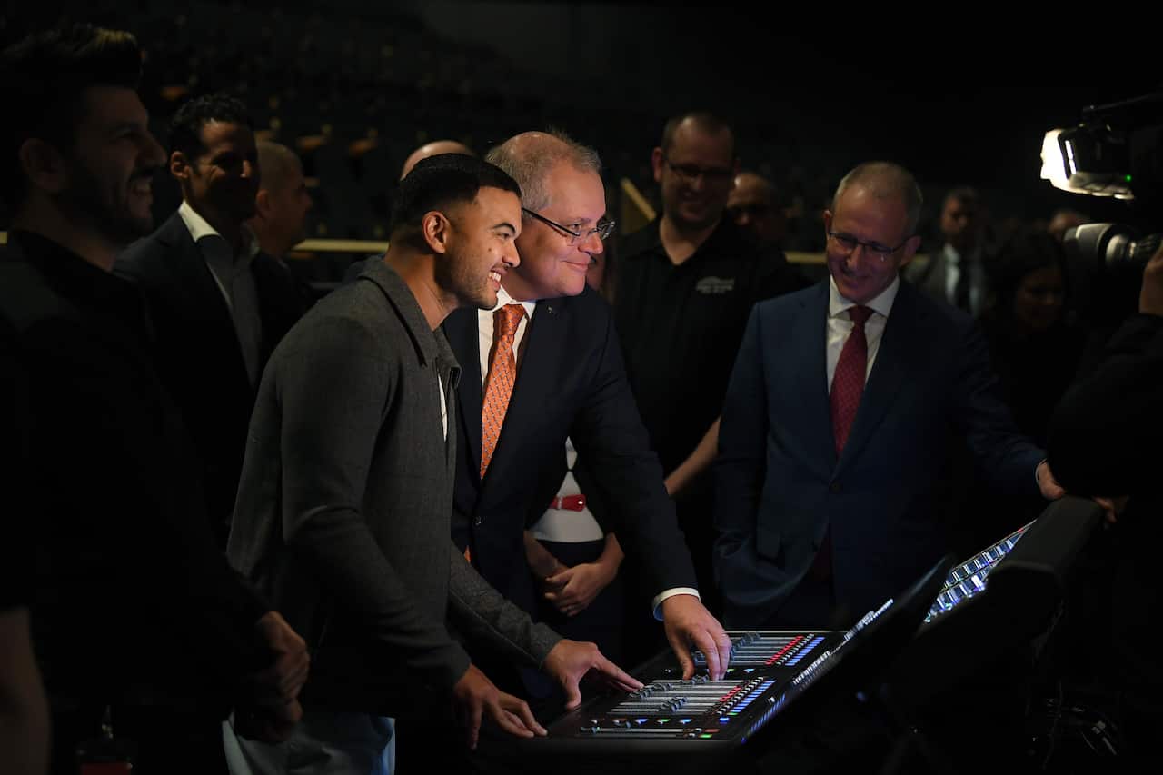 Australian Prime Minister Scott Morrison and singer Guy Sebastian view a sound desk in the Sydney Coliseum Theatre during a tour of West HQ at Rooty Hill in Sydney, Thursday, June 25, 2020. (AAP Image/Joel Carrett) NO ARCHIVING