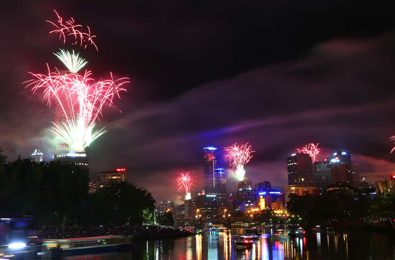 New Year's Eve fireworks over the Yarra river and Melbourne at midnight, Wednesday, Jan. 1, 2014. (AAP Image/David Crosling) NO ARCHIVING